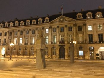 Facade of historical building at night