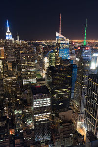 Illuminated buildings in city at night