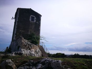 Low angle view of old building against sky