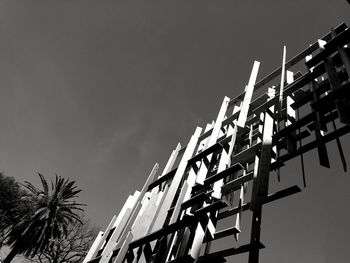 Low angle view of palm trees against clear sky