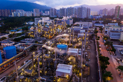 High angle view of illuminated factory at night