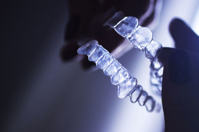 Close-up of hand holding mouthguard