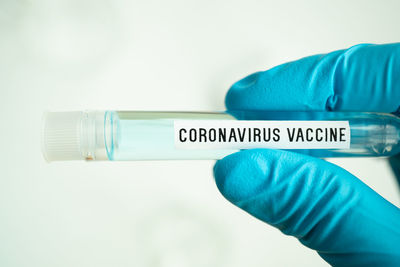 Close-up of human hand against white background