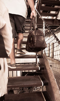 Low section of man wearing shoes