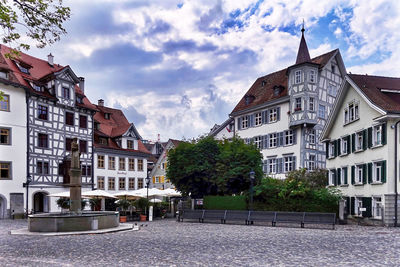 Buildings in city against sky