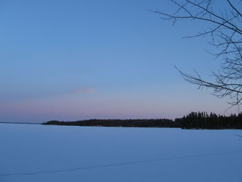 Scenic view of lake against clear blue sky