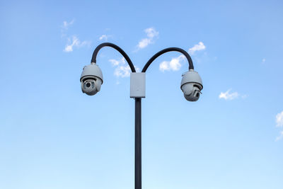 Low angle view of street light against sky