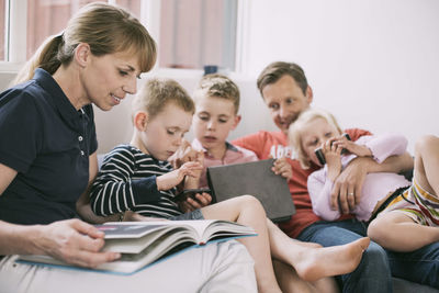 Family spending leisure time in living room