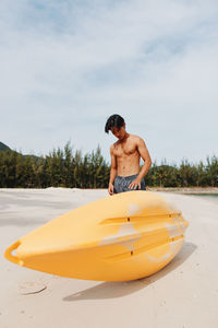 Portrait of young woman kayaking in sea