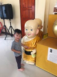 Portrait of smiling boy on table