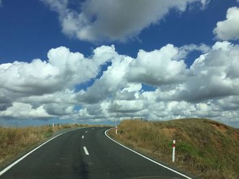 Road amidst landscape against sky