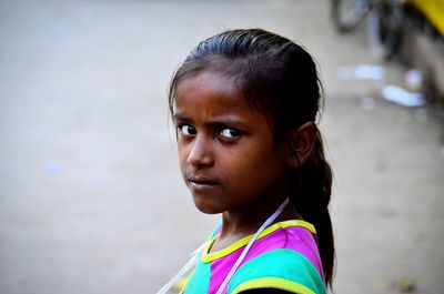 Portrait of girl standing outdoors