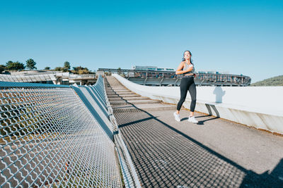 Female athlete running on steps