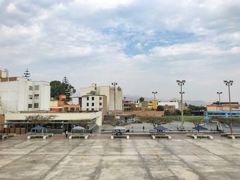 Buildings in city against sky