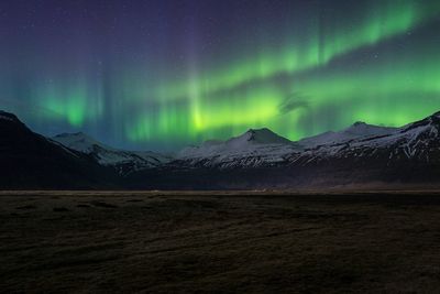 Scenic view of mountains against sky at night