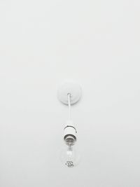 Close-up of lamp over white background