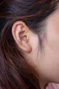 Side view of woman with brown hair