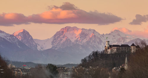 Panoramic view of snowcapped mountains against sky during sunset