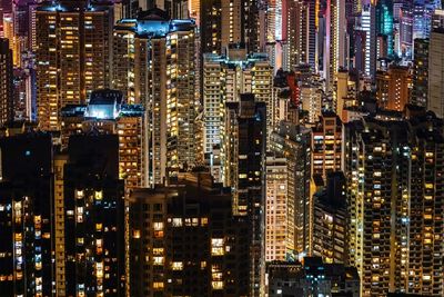 Aerial view of city lit up at night