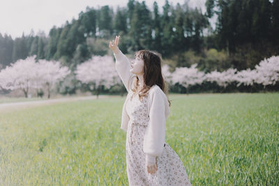 Woman standing on field