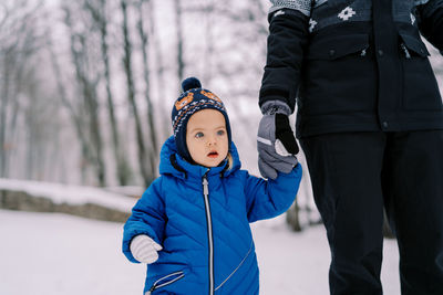 Portrait of woman standing in snow