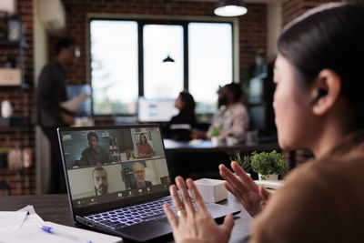 Businesswoman using on video call at office