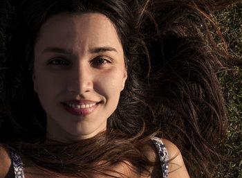 Close-up portrait of a smiling young woman