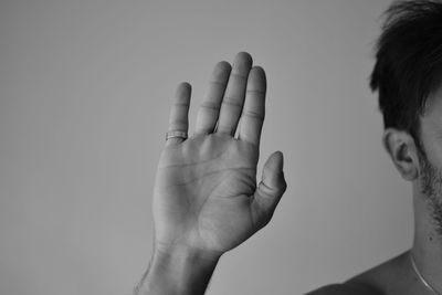 Close-up of human hand against white background