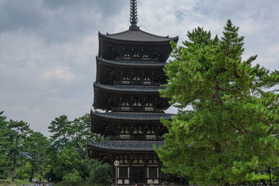 Low angle view of traditional building against sky