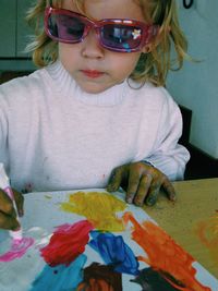 High angle view of girl playing with red umbrella