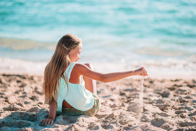 Rear view of woman on beach