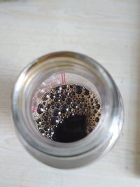 High angle view of glass jar on table