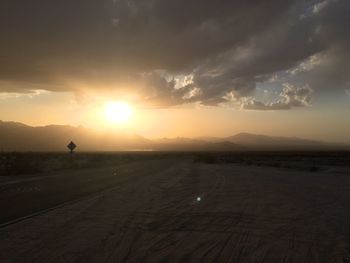 Scenic view of road against sky during sunset