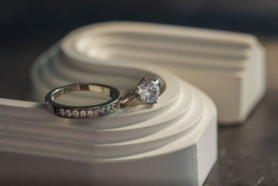 Close-up of wedding rings on table