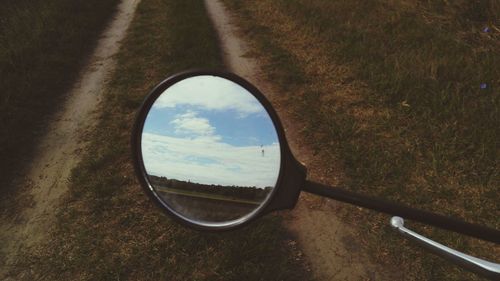 Reflection of cloudy sky on window