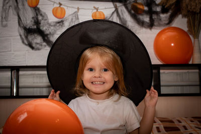 Portrait of smiling girl wearing hat