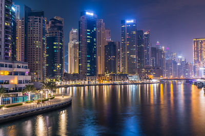 Dubai marina. illuminated modern buildings in city at night