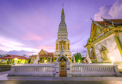 View of temple building against cloudy sky, thatchampa pagoda