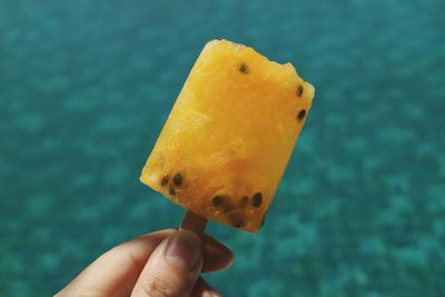 Close-up of hand holding ice cream