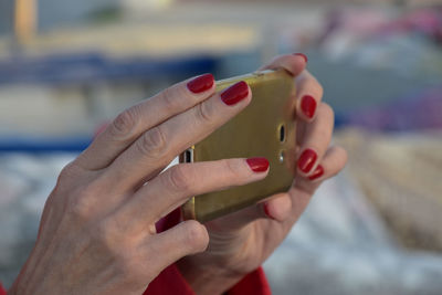 Close-up of woman holding hands