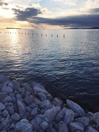 Scenic view of sea against sky at sunset