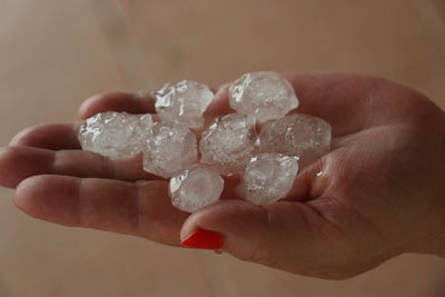 Close-up of woman holding ice