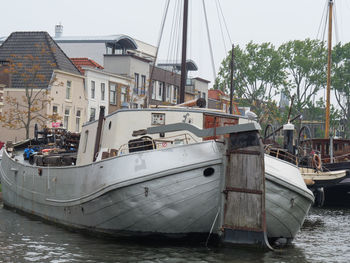 Boats moored at harbor