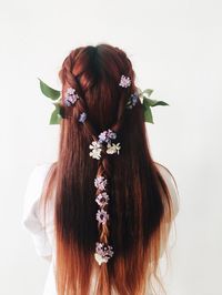 Close-up of woman standing against white background