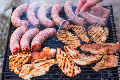 Cropped hand of person preparing food