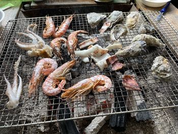 High angle view of seafood on barbecue grill