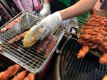 High angle view of preparing food on barbecue grill