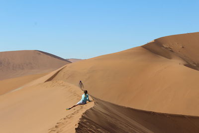 Scenic view of desert against clear sky