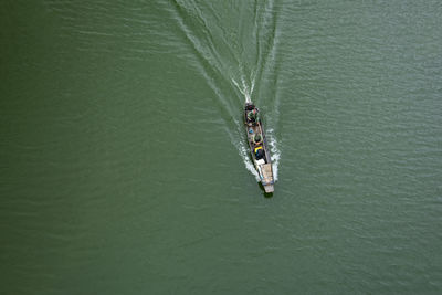 High angle view of people in boat on sea