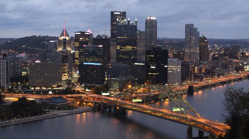 Illuminated city at waterfront